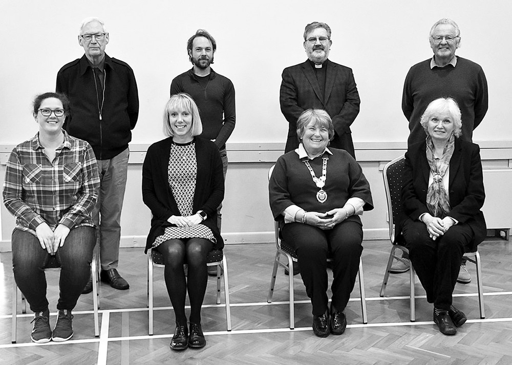 Group photograph of the parish council. Four people sitting and another four standing behind.